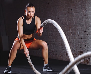 HIIT training male athlete with ropes – functional workout Dubai